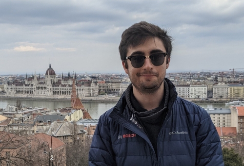 A picture of me with the Hungarian Parliament Building in the background.